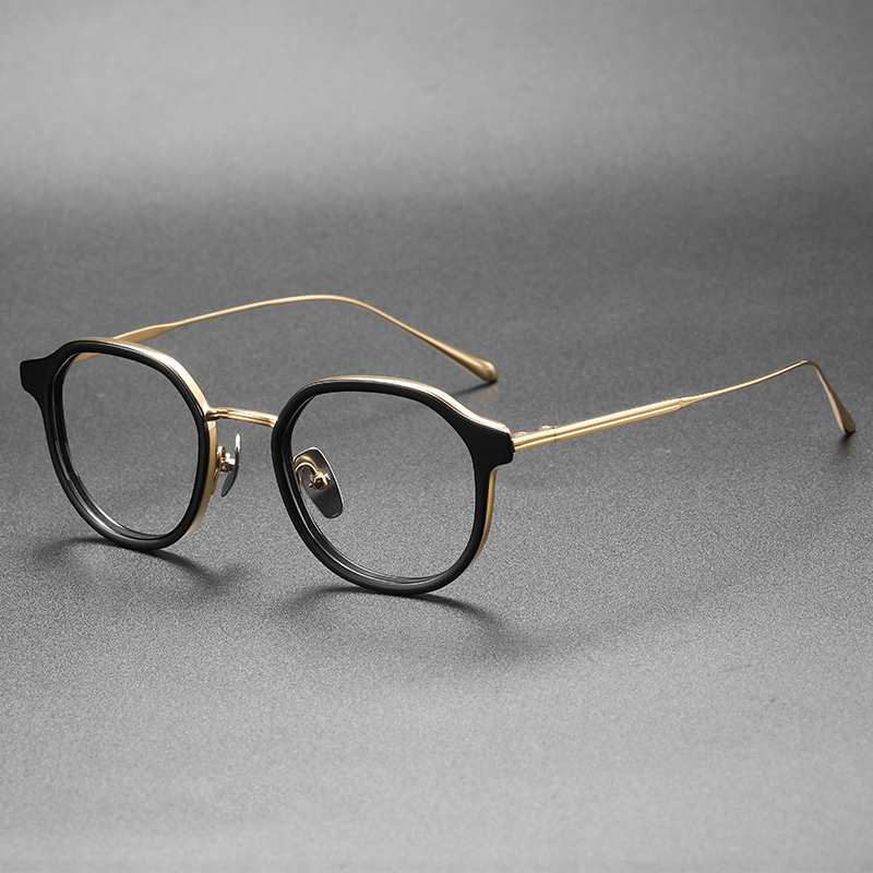 Pure Titanium Eyewear black Frame with gold glass legs.jpg